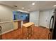 View of kitchen, dining area and living room with hardwood floors at 3041 Peel Ave, Orlando, FL 32806