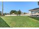 Expansive grassy backyard with patio seating at 1909 Cayman Cove Cir, St Cloud, FL 34772