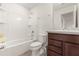 Bathroom with tub, shower and brown vanity at 1909 Cayman Cove Cir, St Cloud, FL 34772