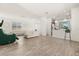Open living area with white sectional sofa and green accent chair at 1909 Cayman Cove Cir, St Cloud, FL 34772