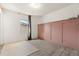 Bedroom with pink accent wall and rug at 1909 Cayman Cove Cir, St Cloud, FL 34772