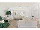Living room showcasing a white sectional sofa and green armchair at 1909 Cayman Cove Cir, St Cloud, FL 34772