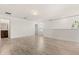 Loft bedroom area with wood-look floors and access to bathroom at 1909 Cayman Cove Cir, St Cloud, FL 34772