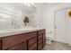 Bathroom with double vanity and wood cabinets at 1909 Cayman Cove Cir, St Cloud, FL 34772