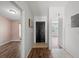 Simple entryway with wood-look floors and access to other rooms at 8850 Grand Palms Circle # B, Kissimmee, FL 34747