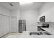 Modern kitchen featuring stainless steel appliances and white cabinets at 8850 Grand Palms Circle # B, Kissimmee, FL 34747