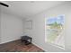Well-lit bedroom with hardwood floors and window blinds at 8850 Grand Palms Circle # B, Kissimmee, FL 34747