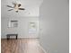 Well-lit bedroom featuring wood-look floors and a ceiling fan at 8850 Grand Palms Circle # B, Kissimmee, FL 34747