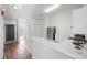 Open concept kitchen with marble countertops and white cabinets at 8850 Grand Palms Circle # B, Kissimmee, FL 34747