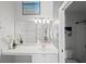 Clean bathroom with white vanity and a large mirror at 8850 Grand Palms Circle # B, Kissimmee, FL 34747
