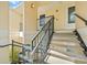 Exterior stairs leading to condo unit with metal railings at 8850 Grand Palms Circle # B, Kissimmee, FL 34747
