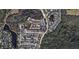 An aerial view of a large residential community with houses, roads, and a lake at 8850 Grand Palms Circle # B, Kissimmee, FL 34747
