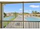 View of community pool, tennis courts from screened balcony at 8850 Grand Palms Circle # B, Kissimmee, FL 34747