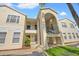 Condo building with multiple units and parking spaces in front at 8850 Grand Palms Circle # B, Kissimmee, FL 34747