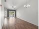 Spacious living room with hardwood floors and sliding glass doors at 8850 Grand Palms Circle # B, Kissimmee, FL 34747