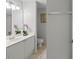 Clean bathroom with white vanity, large mirror, and shower/tub combo at 8850 Grand Palms Circle # B, Kissimmee, FL 34747