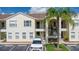 Two-story building with ample parking and tropical landscaping at 8850 Grand Palms Circle # B, Kissimmee, FL 34747