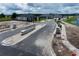 Aerial view of a new community entrance with stone columns and landscaping at 2619 Great Heron Ave, Saint Cloud, FL 34773