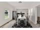 Modern dining room with white table and chairs at 500 N 13Th St, Leesburg, FL 34748