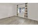 Well-lit bedroom with large window and wood-look flooring at 500 N 13Th St, Leesburg, FL 34748