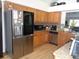 Modern kitchen with granite countertops and stainless steel appliances at 2618 Coventry Ln, Ocoee, FL 34761