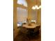 Bright breakfast nook with wood table and chairs, overlooking the backyard at 2618 Coventry Ln, Ocoee, FL 34761