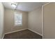 Bright bedroom with carpet flooring and a window at 112 S Moss St, Leesburg, FL 34748