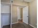 Bedroom with built-in shelving and access to another room at 112 S Moss St, Leesburg, FL 34748