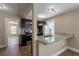 Modern kitchen with granite countertops, stainless steel appliances, and breakfast bar at 112 S Moss St, Leesburg, FL 34748