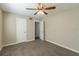 Bedroom with ceiling fan and access to another room at 112 S Moss St, Leesburg, FL 34748
