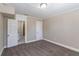 Cozy carpeted bedroom with access to a full bathroom at 112 S Moss St, Leesburg, FL 34748