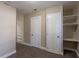 Hallway with two closets and carpet flooring at 112 S Moss St, Leesburg, FL 34748