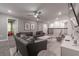 Open concept basement with comfortable seating, large TV, and access to other rooms at 2816 Simile St, Kissimmee, FL 34746