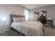Bedroom with a queen-size bed and built-in workspace at 2816 Simile St, Kissimmee, FL 34746