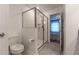Clean bathroom with toilet and walk-in shower at 2816 Simile St, Kissimmee, FL 34746