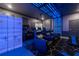 Home theater with black reclining seats and blue lighting at 2816 Simile St, Kissimmee, FL 34746