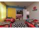 Cars themed bedroom with two twin beds and movie mural at 2816 Simile St, Kissimmee, FL 34746