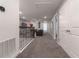 Upstairs hallway with carpet, access to bedrooms and living area at 2816 Simile St, Kissimmee, FL 34746