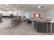 Open floorplan with kitchen, living and dining areas at 2816 Simile St, Kissimmee, FL 34746