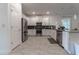 Modern kitchen with white cabinets, stainless steel appliances, and tile flooring at 2816 Simile St, Kissimmee, FL 34746