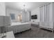King-size bed, crib, and a modern wall-mounted TV in this well-lit bedroom at 2816 Simile St, Kissimmee, FL 34746