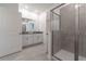 Modern bathroom with double vanity, shower, and grey tile floors at 2816 Simile St, Kissimmee, FL 34746