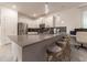 Modern kitchen with stainless steel appliances and a large island at 2816 Simile St, Kissimmee, FL 34746