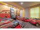 Cars themed bedroom with two twin beds and red car decor at 2816 Simile St, Kissimmee, FL 34746