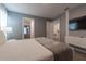 Grey bedroom with double bed and access to hallway at 2816 Simile St, Kissimmee, FL 34746
