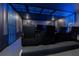 Home theater with black reclining seats and blue lighting at 2816 Simile St, Kissimmee, FL 34746