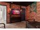 Themed bedroom with a brick feature wall and TV at 2816 Simile St, Kissimmee, FL 34746