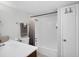 Clean bathroom with shower/tub combo and dark vanity at 5080 Seminole Ave, Winter Park, FL 32792