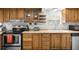 Well-equipped kitchen with wood cabinets and stainless steel appliances at 5080 Seminole Ave, Winter Park, FL 32792