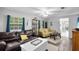 Cozy living room with hardwood floors and comfy furniture at 5080 Seminole Ave, Winter Park, FL 32792